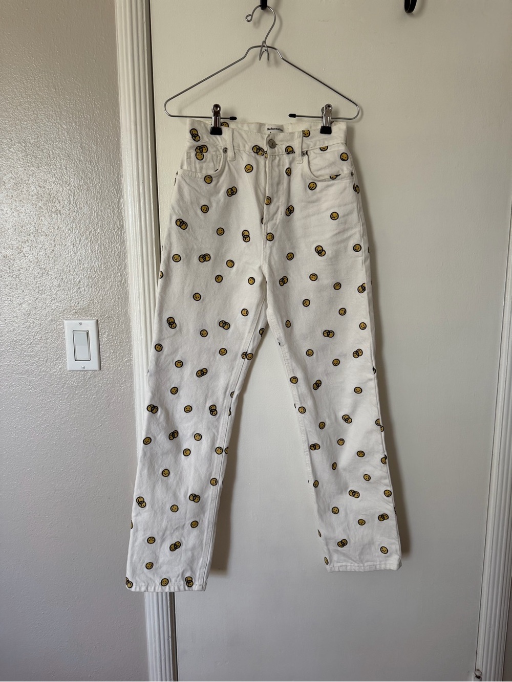 Reformation White High-Rise Jeans with Yellow Smiley Print